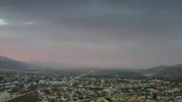 LOS CABOS MEXICO-2020: Far Top View Of A Scattered City Between Mountains And A