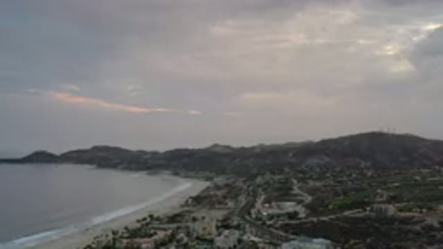 LOS CABOS MEXICO-2020: Aerial View At Sunrise At Beach As Mountains And Clouds