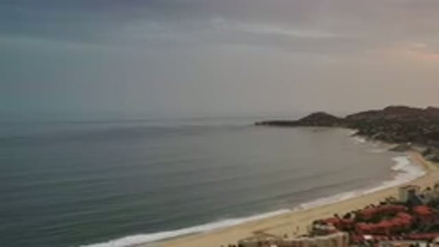 LOS CABOS MEXICO-2020: Aerial View Of Sandy Beach On The Ocean With Rooftops Of