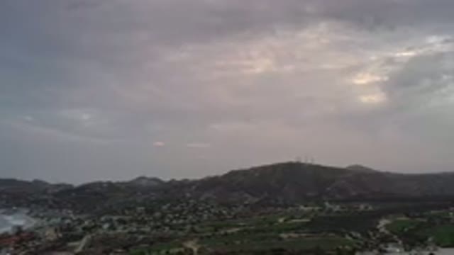 LOS CABOS MEXICO-2020: Landscape With Purple Skyline And Mountain On The Horizon
