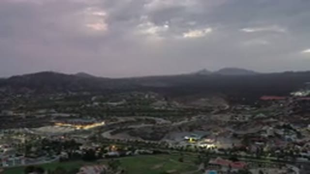 LOS CABOS MEXICO-2020: Cityscape at Noon with Cloudy Sky and Mountains