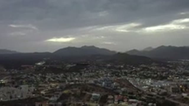 LOS CABOS MEXICO-2020: Quiet City Top View Rain Clouds Mountains Surrounded By