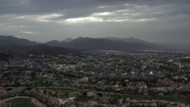 LOS CABOS MEXICO-2020: Nighttime Flyover of a City with Glowing Windows