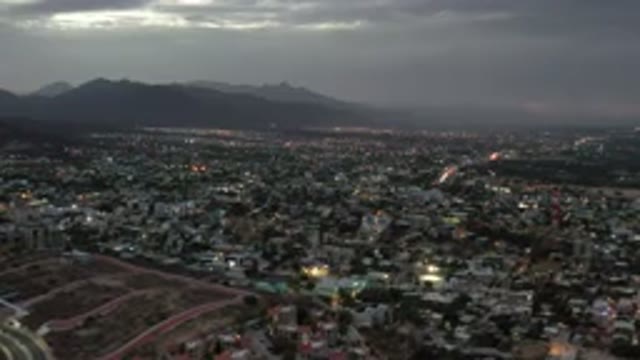 LOS CABOS MEXICO-2020: A View Of A Huge City With Gray Foggy Sky And Mountains