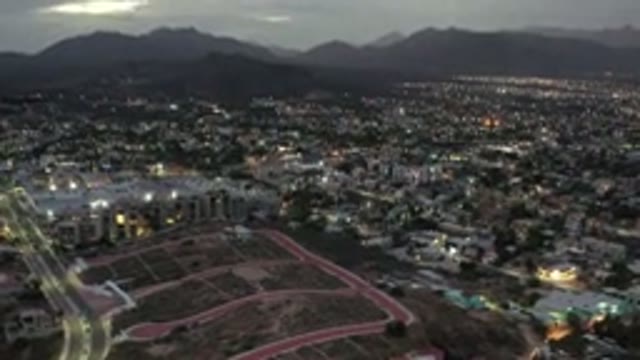 LOS CABOS MEXICO-2020: Aerial Dusk View Of A City With Its Illuminated Lights