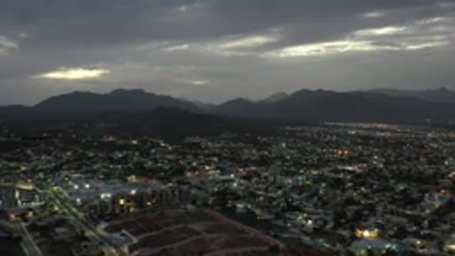 LOS CABOS MEXICO-2020: Drone Slow Pan Shot Of Landscape Over Town With Mountains