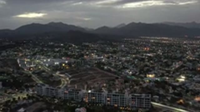 LOS CABOS MEXICO-2020: Aerial View Of A City With Buildings Houses Trees In A