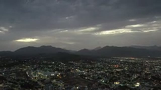LOS CABOS MEXICO-2020: Gray Clouds Over Dark Sky At Sunset In A City With