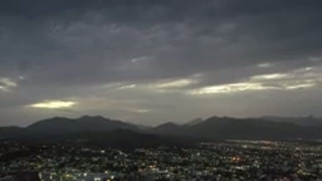 LOS CABOS MEXICO-2020: The Sun Sets Over A Sleeping City With Mountains In The