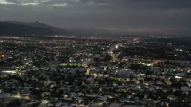 LOS CABOS MEXICO-2020: A City Lit Up Under A Cloudy Sky With Lots Of Clouds And