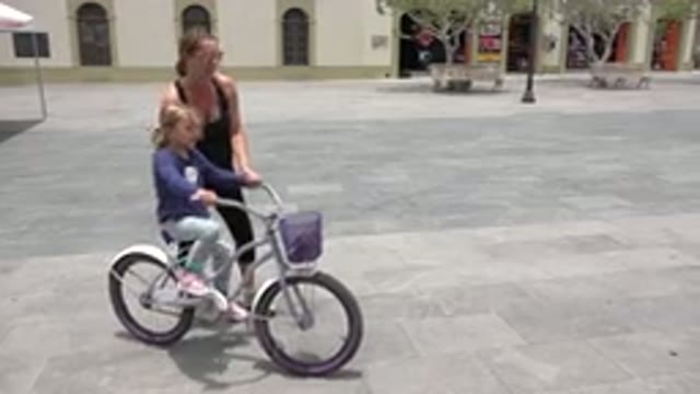 LOS CABOS MEXICO-2020: A Young Mother Teach And Help Her Daughter While She Rides A Bicycle