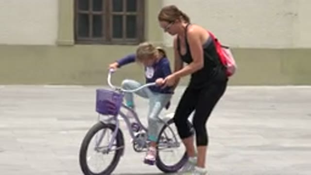 LOS CABOS MEXICO-2020: Mother Teaches Daughter to Ride a Bike