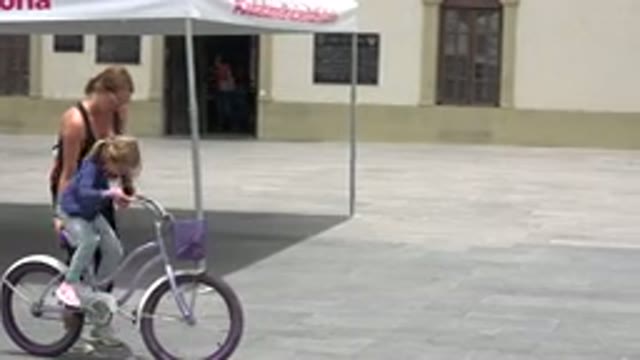 LOS CABOS MEXICO-2020: An Adult Teaching a Kid How to Ride a Bicycle