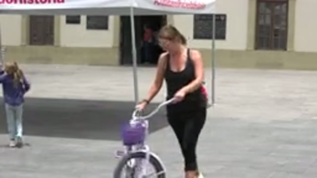LOS CABOS MEXICO-2020: Mother Walking Purple Bike Follows Daughter Closely