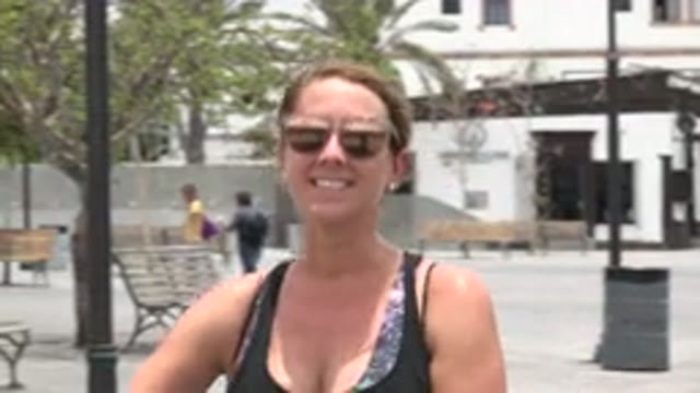 LOS CABOS MEXICO-2020: A Woman With Sunglasses Talking To A Camera In A Park On