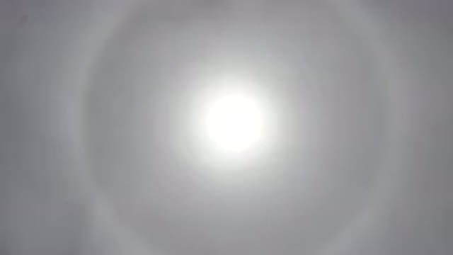LOS CABOS MEXICO-2020: Sun Shining Brightly With A Rainbow Colored Circle Around