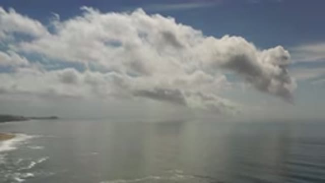 LOS CABOS MEXICO-2020: Large Low Clouds Over A Beach And Open Ocean During The