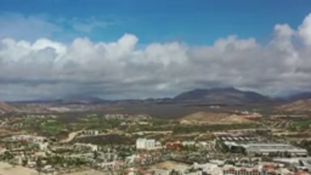 LOS CABOS MEXICO-2020: View Of The Sky And A Town With Mountains In The Background