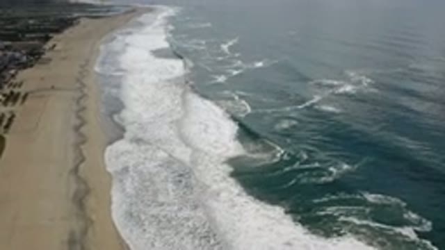 LOS CABOS MEXICO-2020: Sea Waves Against The Sand On An Empty Beach