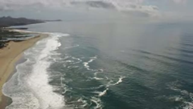 LOS CABOS MEXICO-2020: Panoramic View of Ocean Shore as Waves Wash Up the Beach