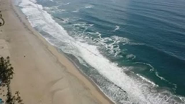 LOS CABOS MEXICO-2020: Dark Blue Ocean Water Crashes Into White Foamy Waves As