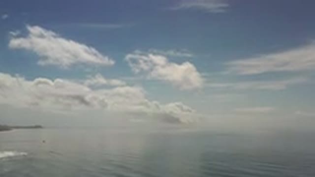 LOS CABOS MEXICO-2020: Low Scattered Clouds Over Water On A Very Calm Day