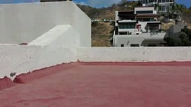 LOS CABOS MEXICO-2020: Drone Landing On Roof Of Modern Building In Beautiful