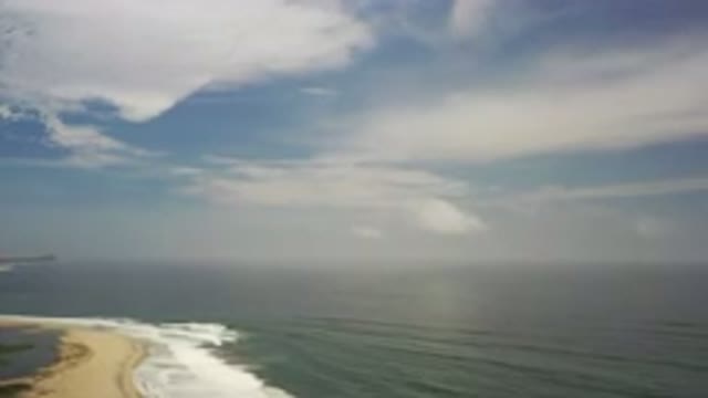 LOS CABOS MEXICO-2020: Aerial View Of Waves Washing Ashore Of Beach With A Few