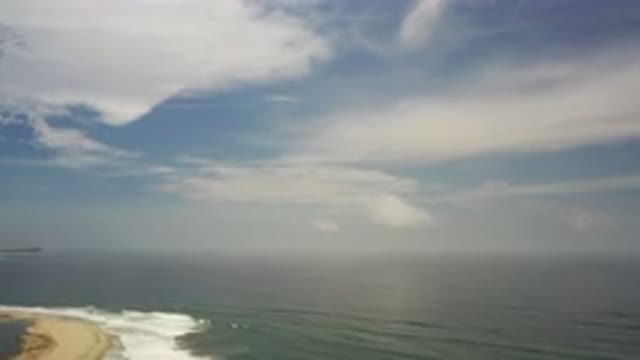 LOS CABOS MEXICO-2020: A Calm Blue Sea Meeting A Beach Illuminated By An