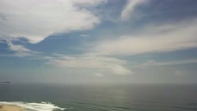 LOS CABOS MEXICO-2020: Clouds Drifting Slowly Over The Ocean Tides Shading The Beach