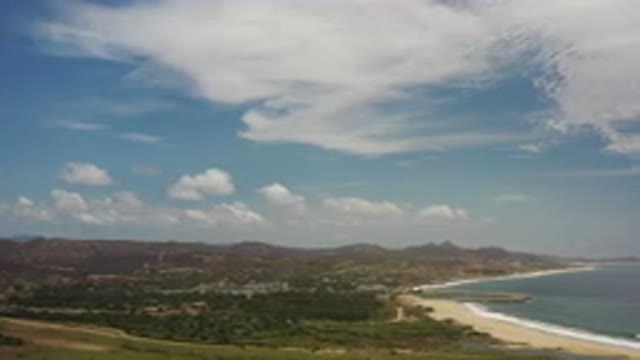 LOS CABOS MEXICO-2020: Blue Sky With Clouds Above Beautiful Beach Next To Green