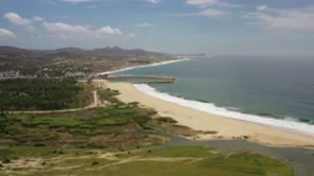 LOS CABOS MEXICO-2020: A View Of The Shore And Ocean On A Sunny Cloudy Day