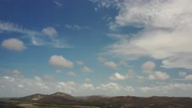 LOS CABOS MEXICO-2020: Blue Sky With White Clouds And Mountain Region With Green