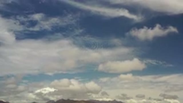 LOS CABOS MEXICO-2020: Over the Horizon Fluffy White Clouds Float on a Azure Sky