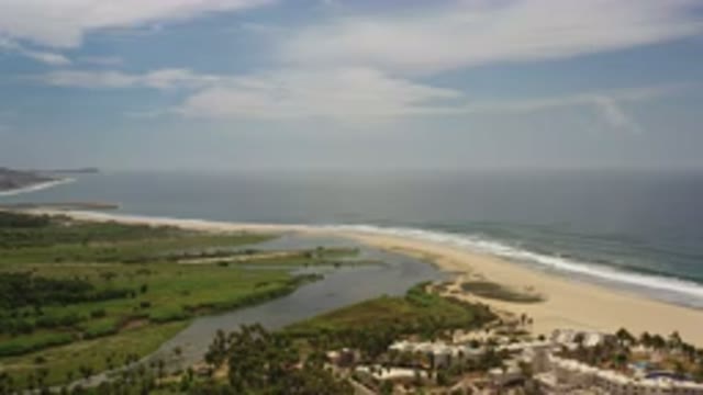 LOS CABOS MEXICO-2020: Green Space And Sandy Beach Along Ocean Edge