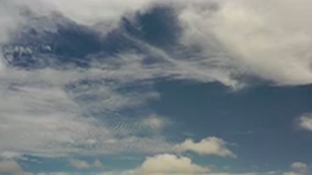 LOS CABOS MEXICO-2020: White Cumulus Clouds Drift Across a Clear Blue Sky