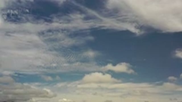 LOS CABOS MEXICO-2020: Scattered Light Cloud Cover Over Low Hills With Horizon