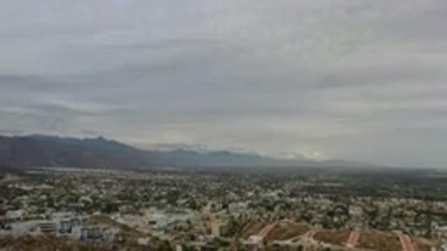 LOS CABOS MEXICO-2020: Gray And White Clouds Cover The Skyline Above A City With
