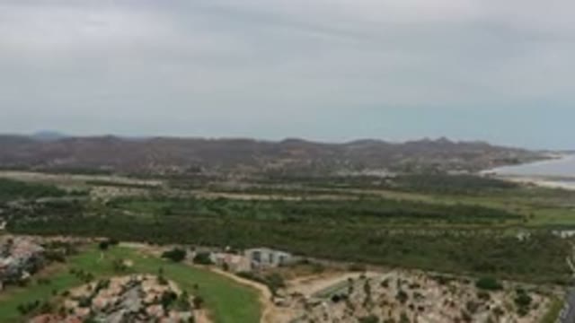 LOS CABOS MEXICO-2020: Overcast Sky Looms Over Small Mountains Overlooking Far