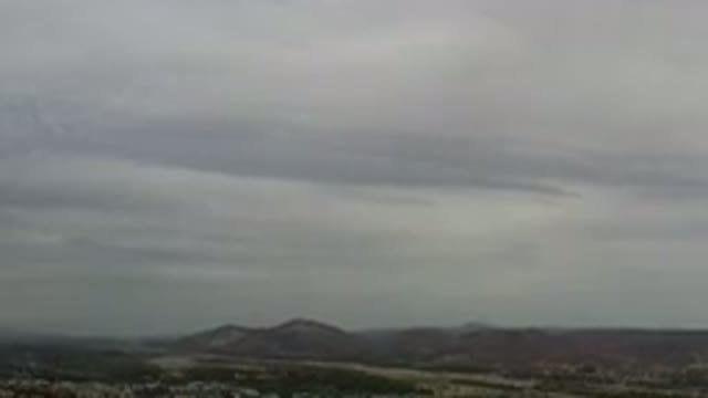 LOS CABOS MEXICO-2020: Gray And White Clouds Blanket The Sky Above A City With