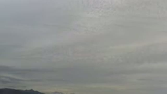 LOS CABOS MEXICO-2020: Clouds Overcast Gray Sky Above Mountains In The Distance