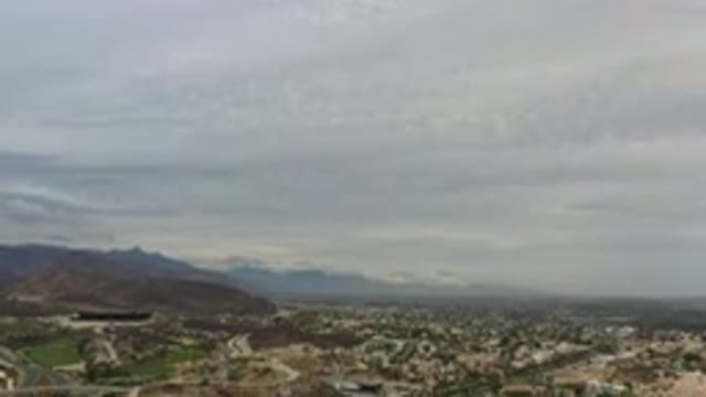 LOS CABOS MEXICO-2020: White Stratus Clouds Blanket A Mountainous City With