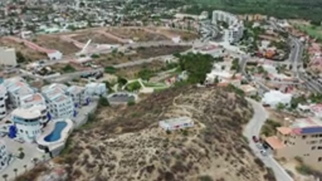 LOS CABOS MEXICO-2020: Flyover of Small Resort Town with Dying Grass and Pool