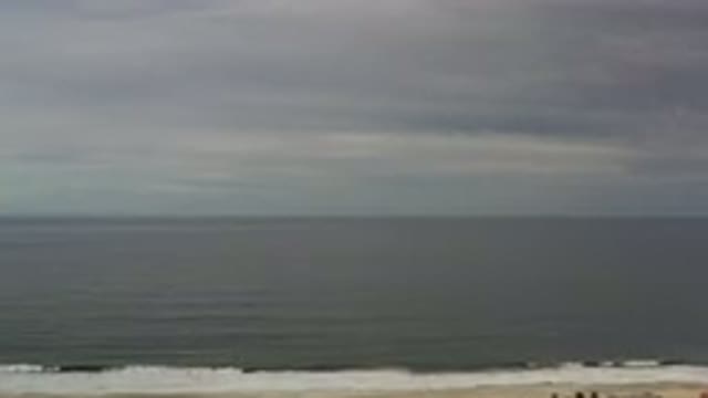 LOS CABOS MEXICO-2020: Small Waves In A Dark Sea On A Slightly Cloudy Day