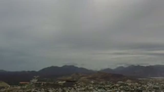 LOS CABOS MEXICO-2020: Aerial View Of The Cloudy Sky Of A City With Large Buildings And Mountains