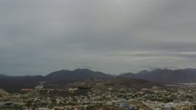 LOS CABOS MEXICO-2020: City With Hills In Background On A Cloudy Day With A Gray Sky