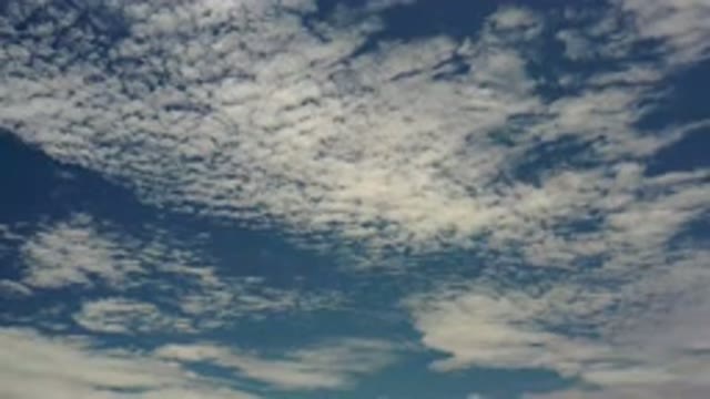 LOS CABOS MEXICO-2020: Fluffy White Clouds Dotting The Sapphire Blue Sky As Far