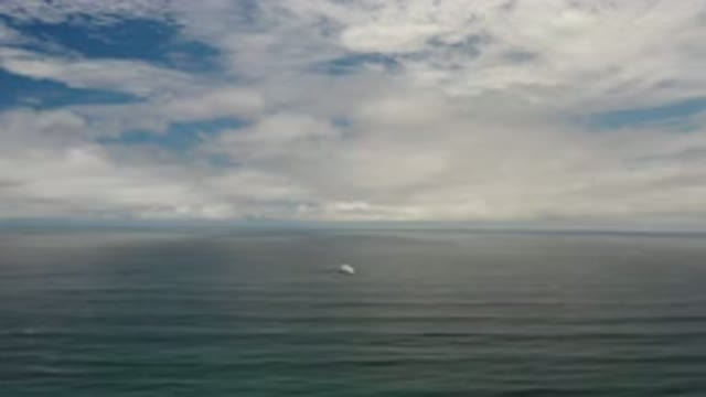 LOS CABOS MEXICO-2020: White Object Floating On Calm Water Under Bright Sky
