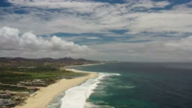 LOS CABOS MEXICO-2020: The Long View Of The Beach And Cloudy Sky Near Mountain