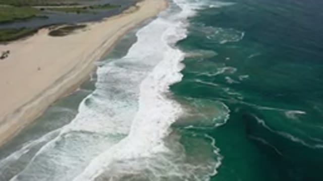 LOS CABOS MEXICO-2020: Drone Shot of Waves Crashing on Beach